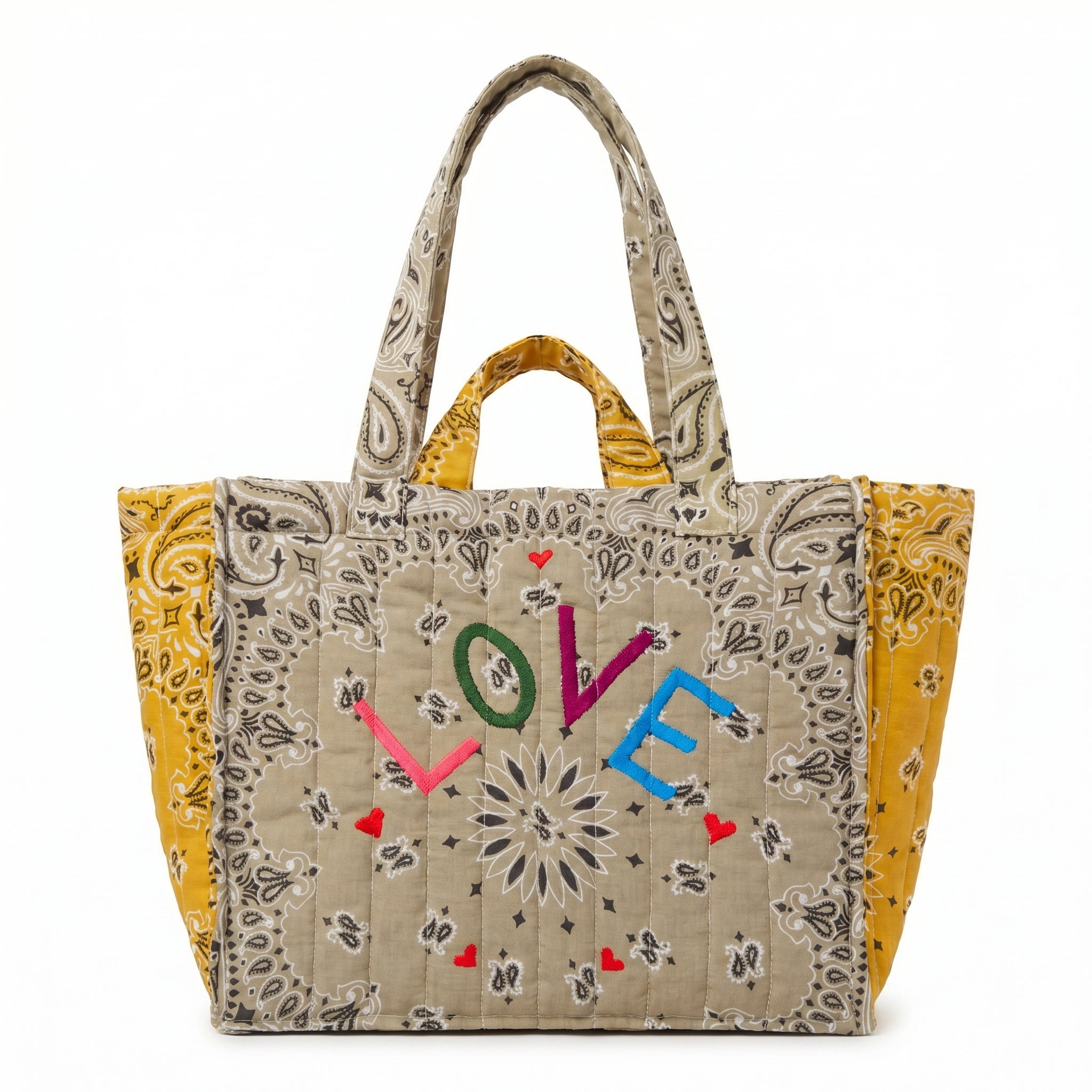 Quilted tote bag with paisley print and multicolor LOVE embroidery, mustard side panels.