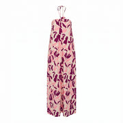 Halterneck maxi dress with bold floral print, pink/mauve on light background.