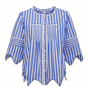 Blue and white striped button-front blouse with ruffled trim and scalloped hem