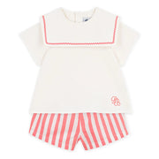 Front cream sailor top with pink zigzag trim and pink-and-white striped shorts