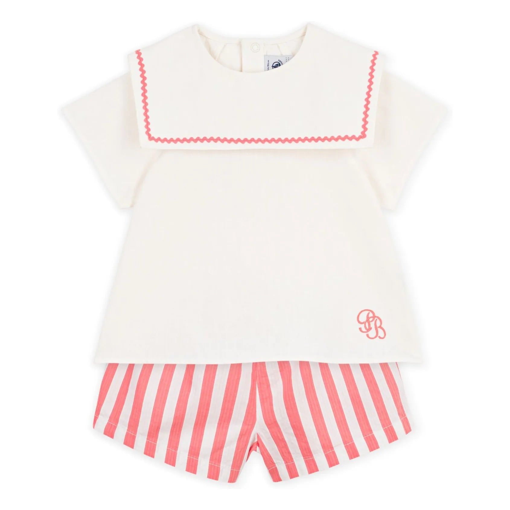 Front cream sailor top with pink zigzag trim and pink-and-white striped shorts
