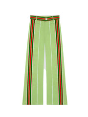 Lime green pants with vertical red and white stripe side panels, button waistband
