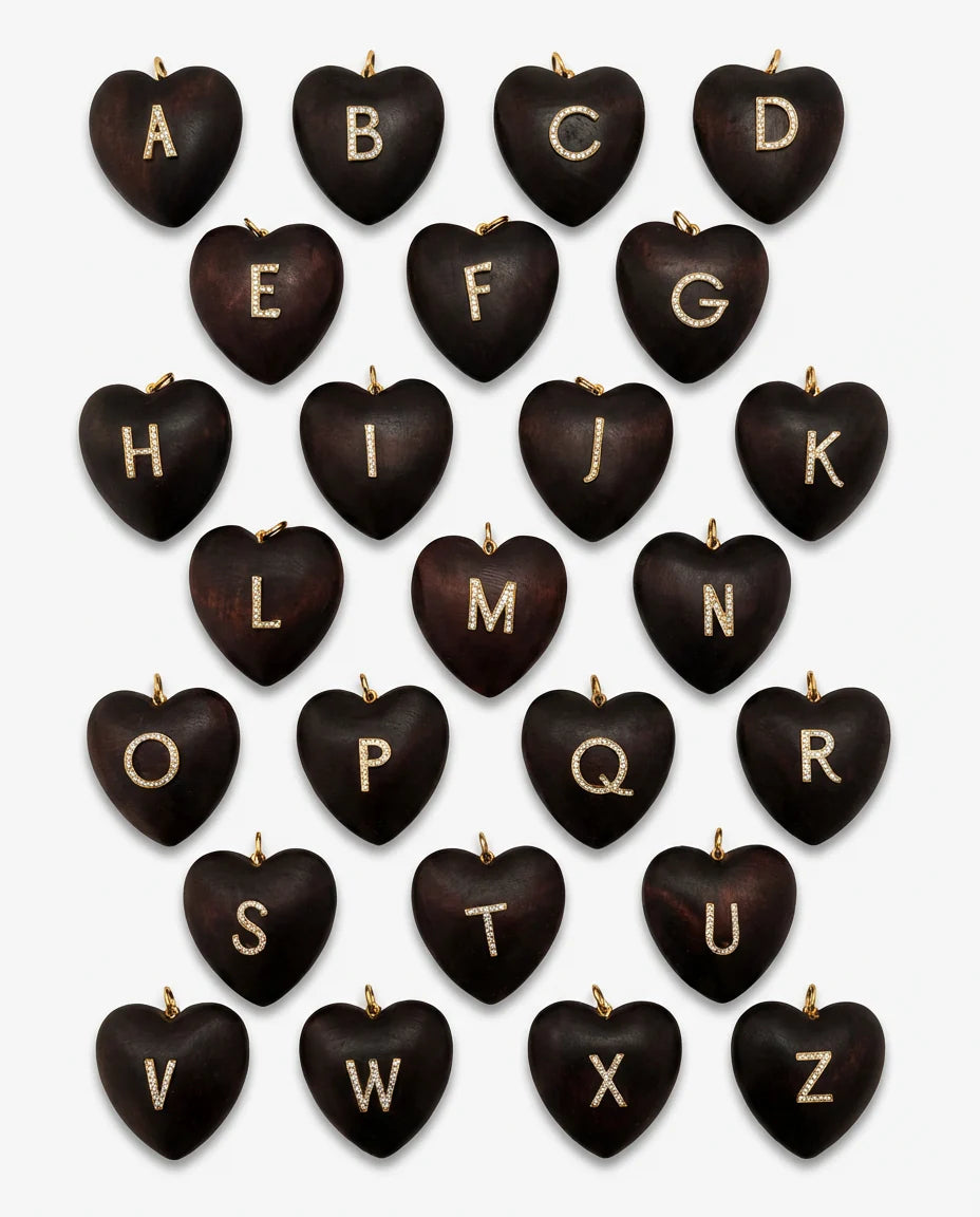 Set of gold-initial heart charms on black heart pendants, letters A to Z