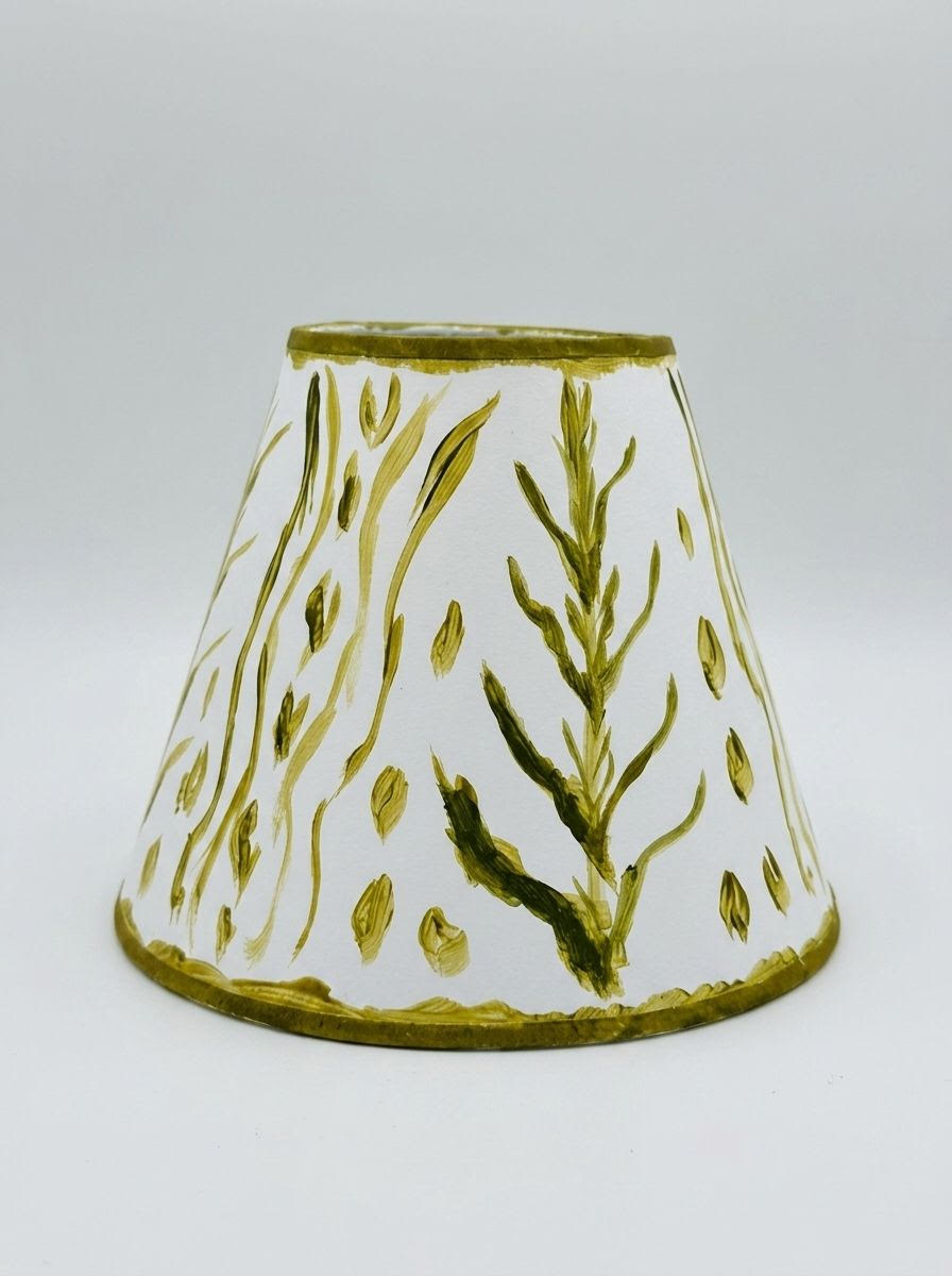 Lampshade with white fabric and green botanical print, gold-trimmed edge