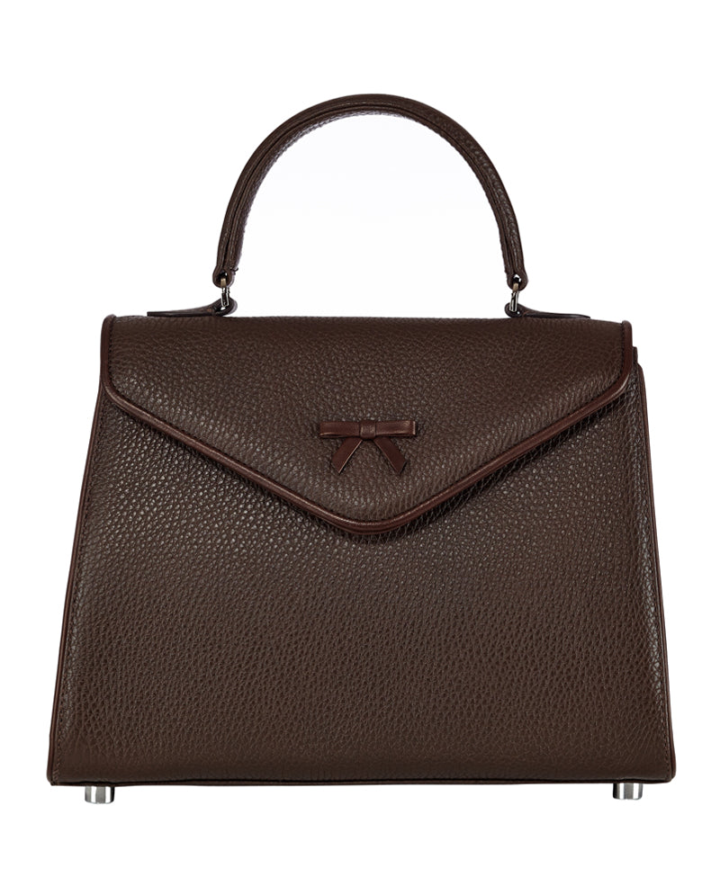 Brown leather handbag with top handles, triangular front clasp, and structured shape